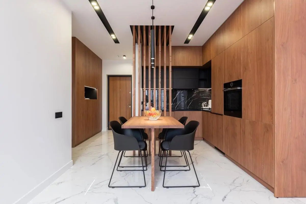 stylish kitchen with wooden furniture and dining zone