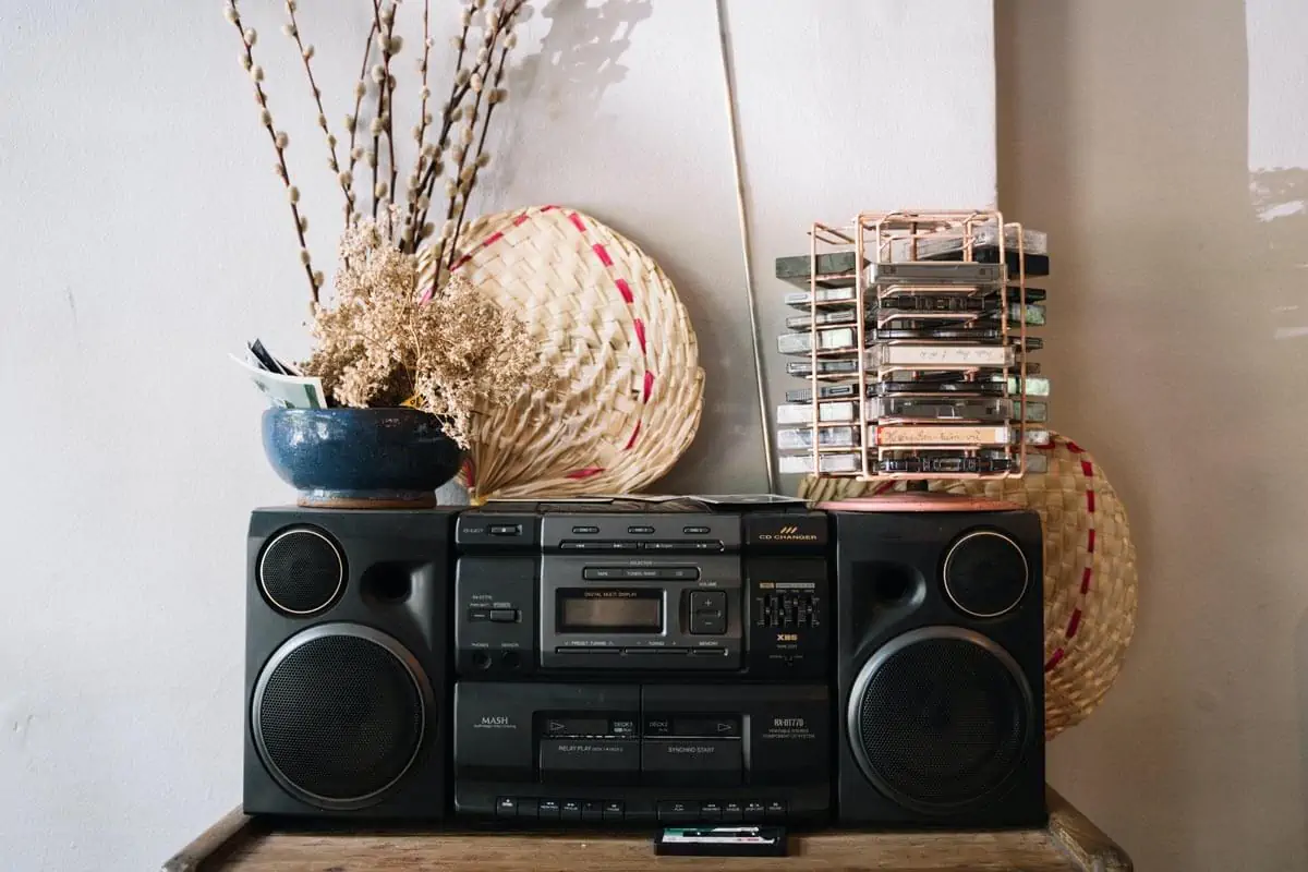 Stereo and Cassette Tapes on Wooden Table