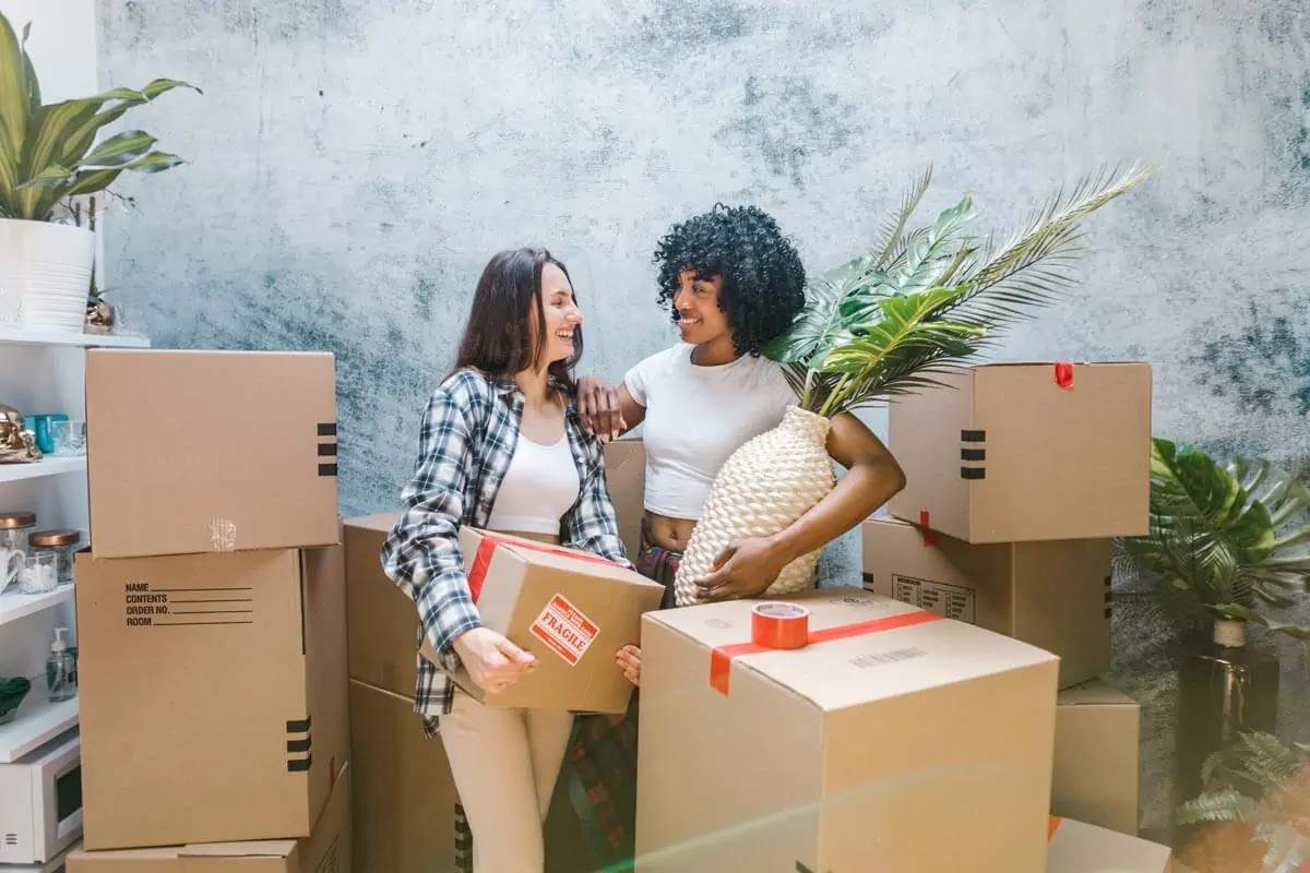 2 Women Surrounded by Boxes