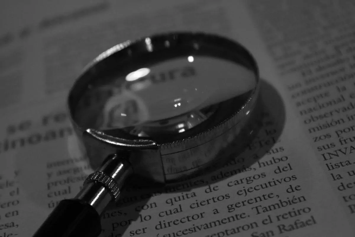 magnifying glass on a book
