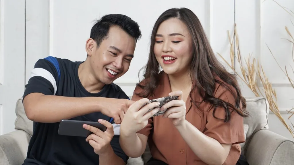 boy and girl holding phone