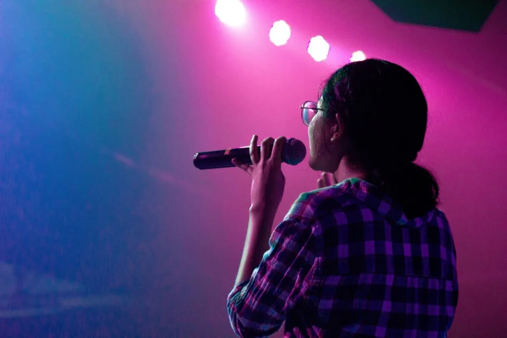 woman holding mic