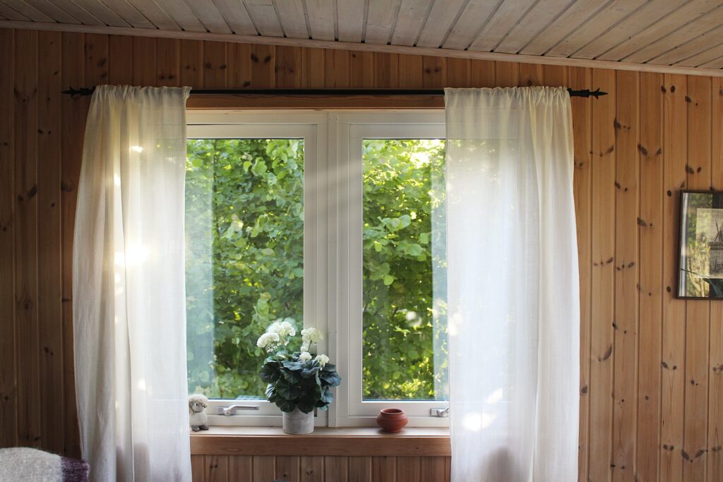 window with plain white curtain