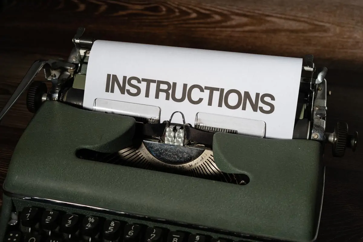 A White Bond Paper with Instructions Text on a Typewriter