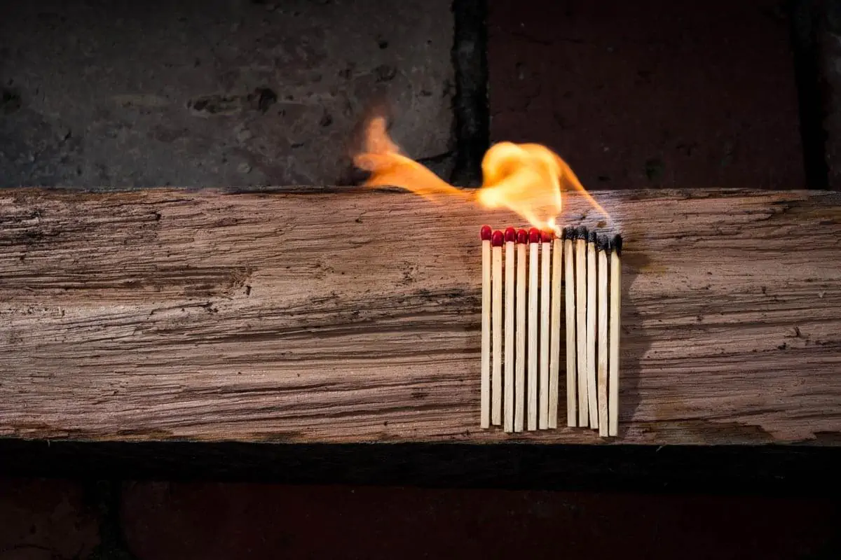 Lighted Matches on Brown Wooden Surface