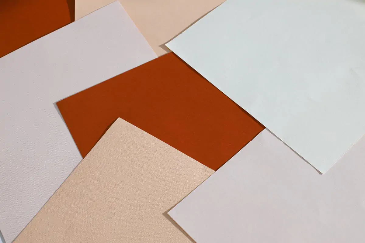 Abstract background of various paper sheets scattered on table