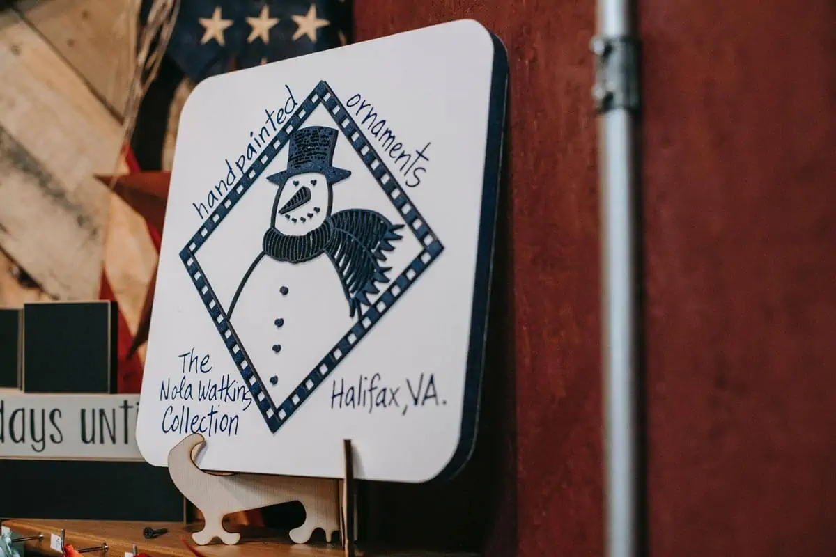 Decorative Christmas coaster with snowman illustration in pub