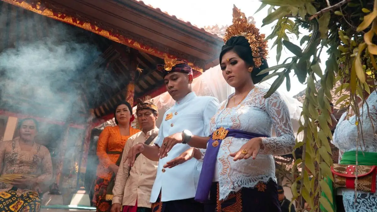 a man and a woman getting married in traditional ceremony