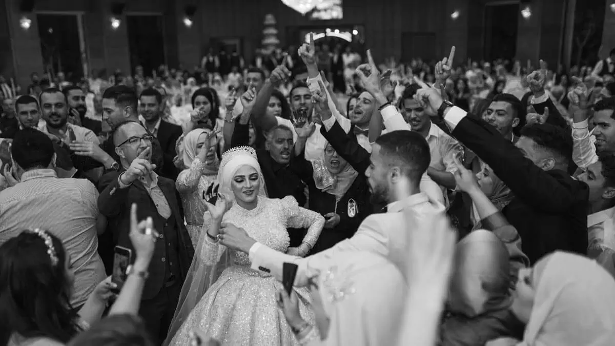 black and white photo of people celebrating a wedding