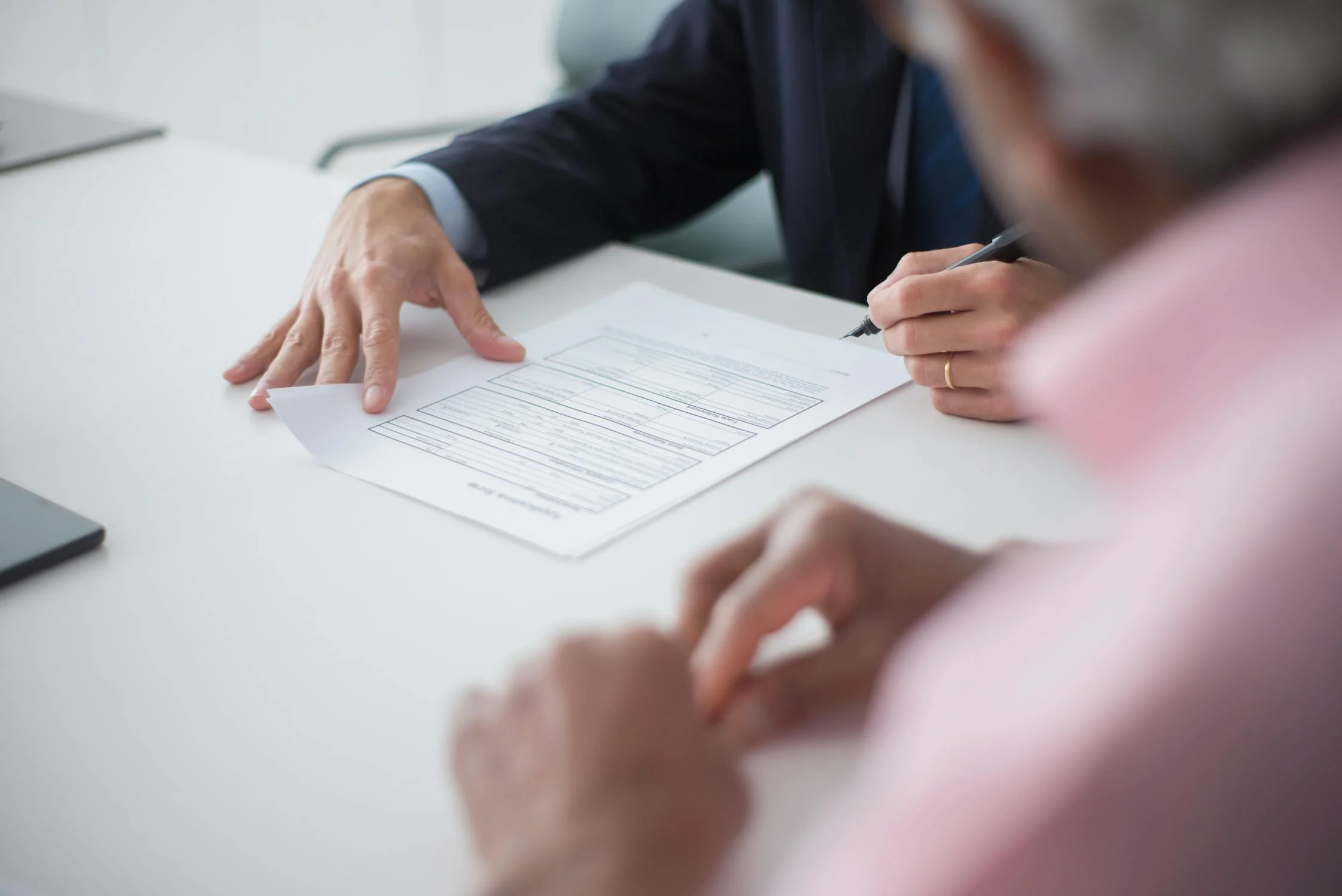 elegant man signing documents