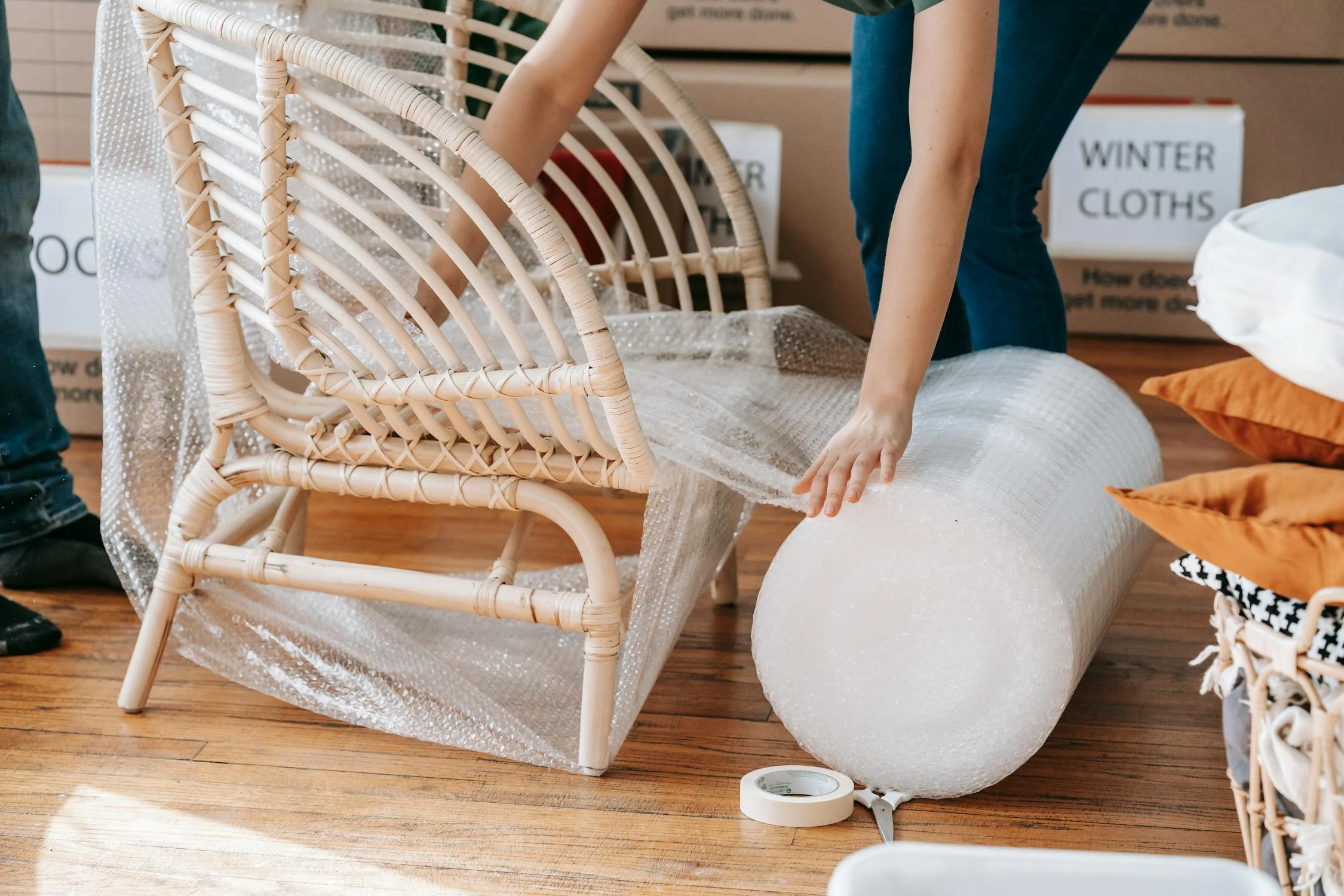 person using bubble wrap on a chair