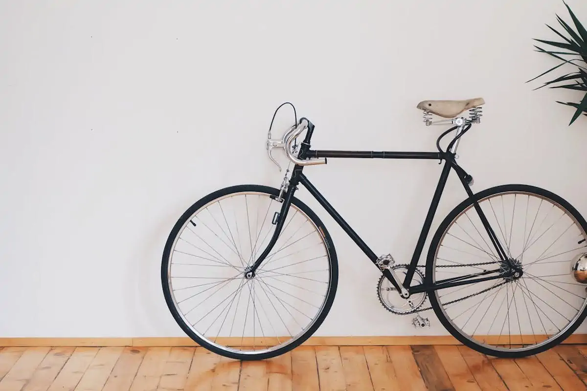 black fixed gear bike beside wall