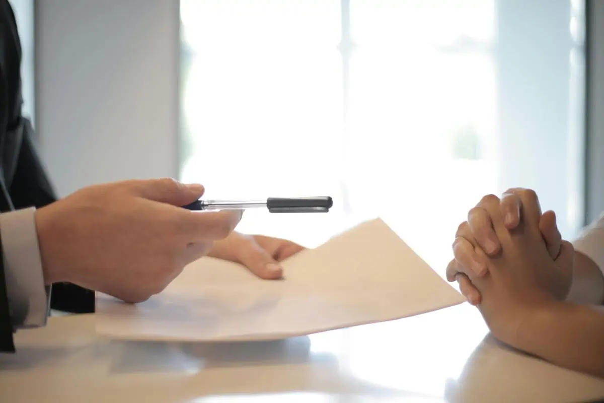 crop businessman giving contract to woman