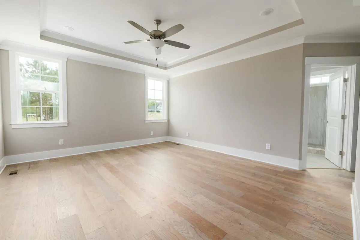 spacious room with a ceiling fan