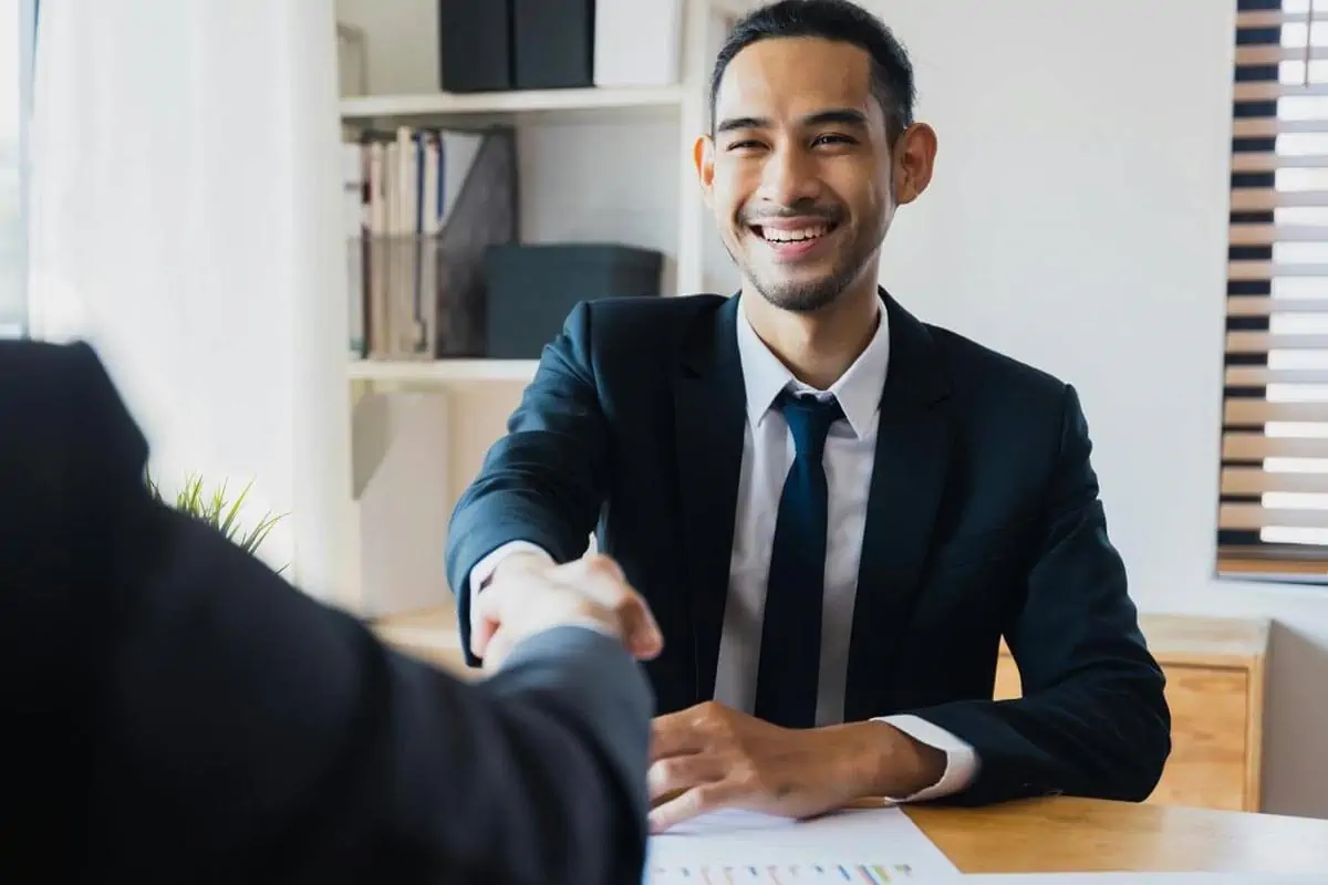 two businessman shake hand with partner