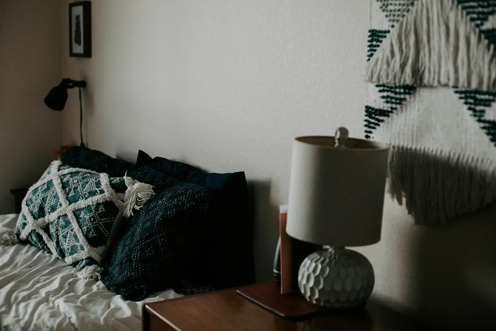 white-table-lamp-on-wooden-side-table