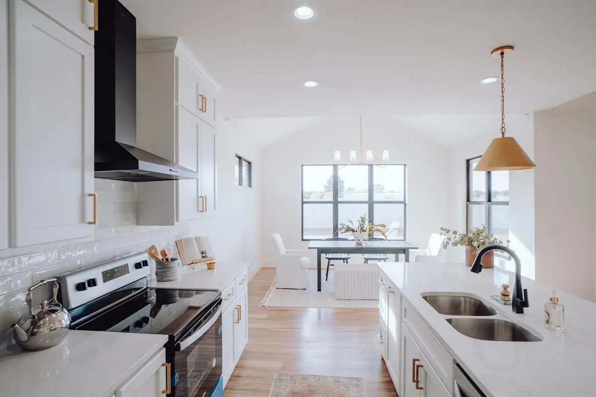 a-kitchen-with-a-sink-stove-and-a-window