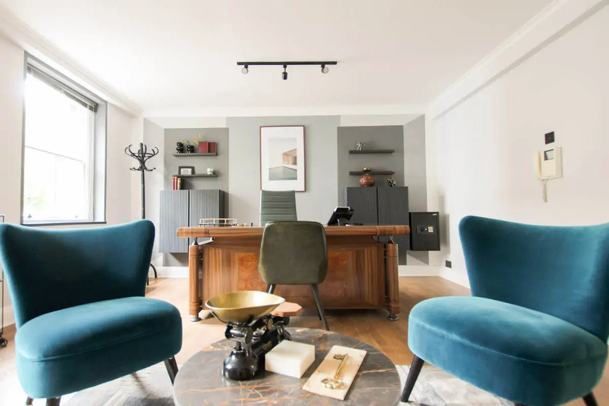 black-and-brown-wooden-table-near-blue-padded-chair