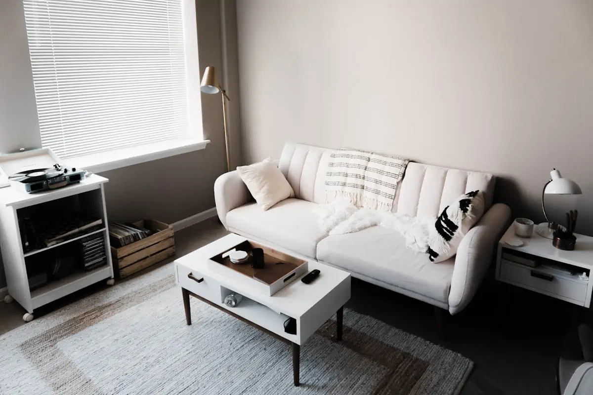 white-couch-in-front-of-white-wooden-table