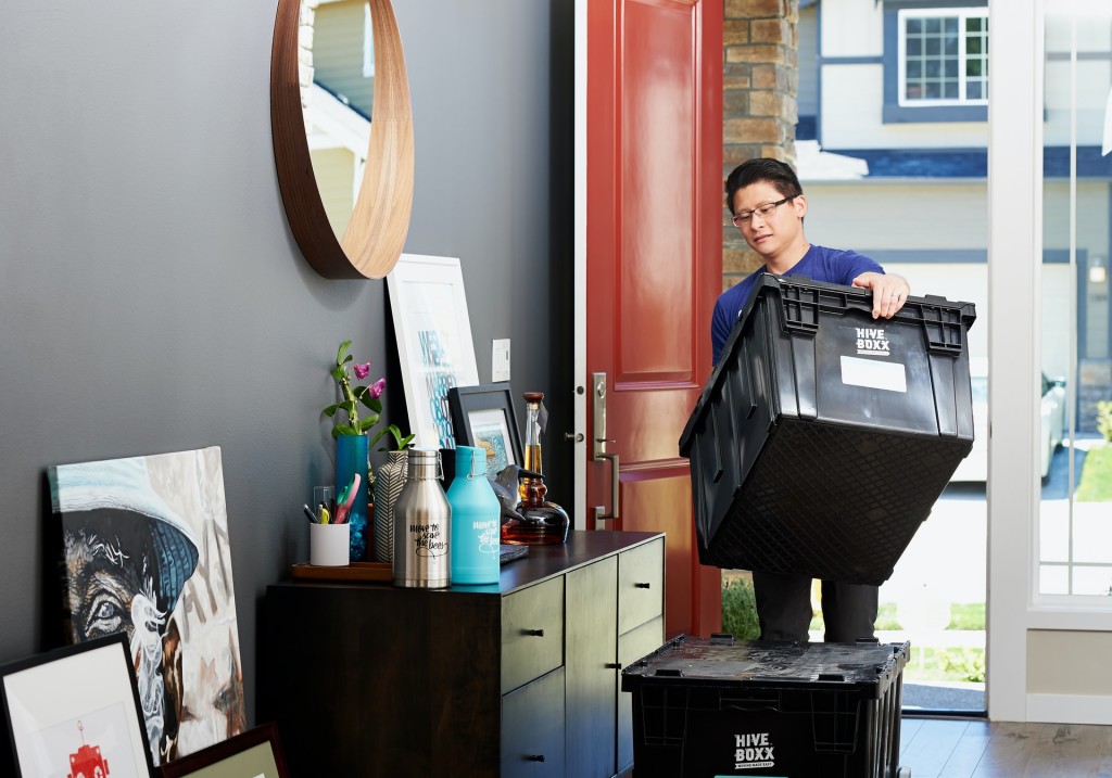 man holding black box