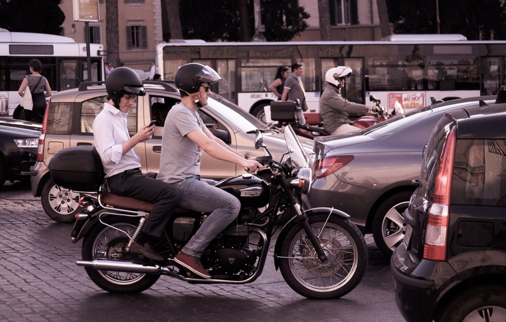 two mans riding motorcycles